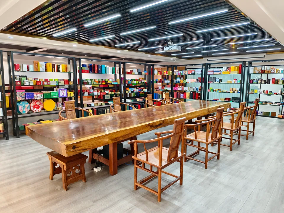 Large Ferostar reception and meeting room with tin packaging samples displayed around a central table